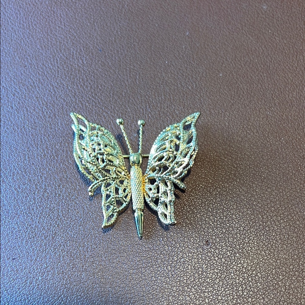 Monet stamped butterfly brooch- gold tone